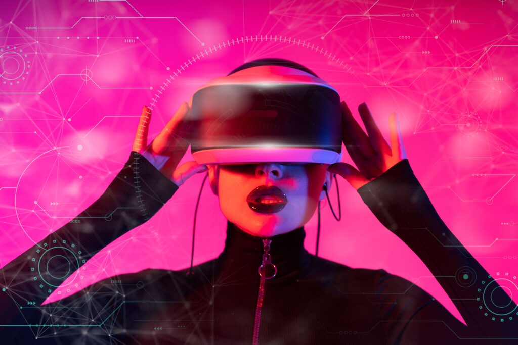 CES 2026 Las Vegas : les 11 tendances qui redessinent la tech A stylish woman interacts with futuristic VR technology in a vibrant setting.